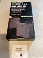 Box front showing Auto Technix branding and product image with litter bag attached to car seat headrest.