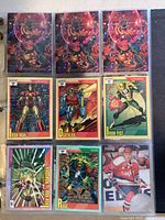 Marvel superhero collectible cards including Iron Man, Deathlok, Iron Fist, Wolverine, Rage and a red holographic character card