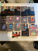 Overhead view of all NES cartridges in protective sleeves and loose on table