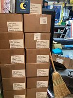 Stack of cardboard boxes labeled for Star Baby books by Tally Dufour with ISBN and quantity per box.