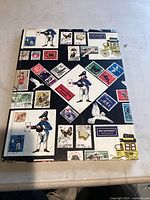 Decorative stamp album cover with various printed stamps depicted on it