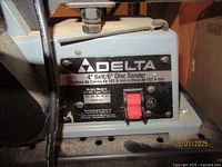 Close-up photo showing Delta brand and model number 31-460 Type 2 on label of sander base, with red power switch and serial number P9545.