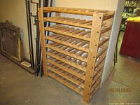Full view of the wooden wine rack from the front showing eight shelves.