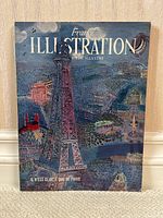 Magazine cover featuring illustrated image of Eiffel Tower and Paris cityscape at night with 'France Illustration' title.
