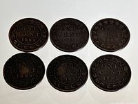 Six Canadian Large One Cent coins arranged with the reverse side showing denomination and dates: 1882 (two coins), 1888, 1895, 1897, 1899.