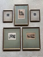 Overview of all five framed original signed etchings arranged on floor, showing size, framing style and mat colors.