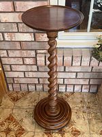 Full view of plant stand showing barley twist column, round top and circular base