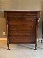 Front view showing overall appearance, drawer layout and turned posts