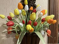 Front view of full bouquet showing arrangement of multicolor tulips