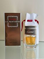 Box, bottle, and pouch displayed together