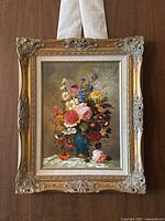 Full view of framed floral oil painting