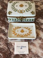 Trinket box and soap dish displayed on marble surface with Laure Sélignac Paris card