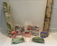 Photo showing complete soap lot with floral drawer liners including boxed liners and various floral-themed soap bars in original wrappers, some in plastic packaging.