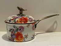 Front view of enamel saucepan with lid and handle