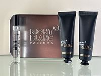 Mont Blanc metal gift box with 7.5ml Eau de Parfum vial, face cream tube, and cleansing gel tube displayed