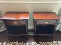 Front view of both side tables together showing matching design and finish