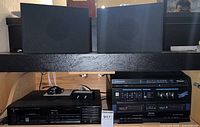 Photo shows Panasonic Studio Music System X88 dual cassette deck and Yorx S-22a bookshelf speakers on upper shelf.