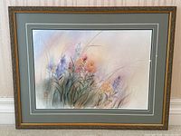 Full view of framed floral watercolor painting showing the overall composition, frame, and mat.
