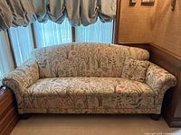 Full front view of sofa showing overall upholstery and style
