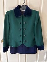 Jacket and skirt on hanger from front