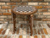 Full front view of round chessboard table