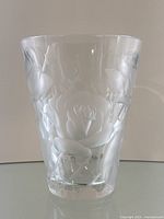 Front view of clear glass Lalique vase with frosted rose motif