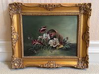 Front view of oil painting in carved gilt frame
