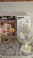 3 heaters and 1 fan shown together with DeLonghi SafeHeat box and other heaters visible