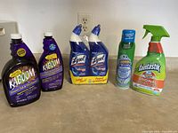 Photo of all bathroom cleaning products on a counter showing brands Kaboom, Lysol, Scrubbing Bubbles, and Fantastik.