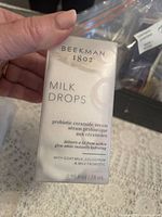 Photo of boxed Beekman1802 Milk Drops probiotic ceramide serum showing front packaging with text about hydration and ingredients.