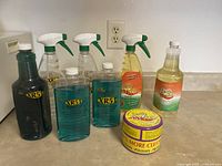 Multiple Earth Brite cleaning products in various bottles arranged on a countertop.