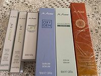 Six boxed M.Asam skin care serums lined up on a surface