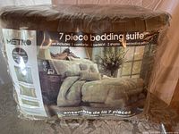 Photo of packaged Metro Sundance 7-piece bedding set showing product labels and packaging.