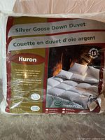 Photo of the duvet in its original packaging, showing the Silver Goose brand, 'Huron' line, and details about the comfort and down content.