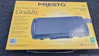 Original box of Presto Cool Touch Electric Griddle with product image and features listed on front