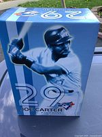 Box front featuring image of Joe Carter in batting stance, Blue Jays logo, and number 29