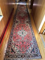 Full-length view of rug runner in hallway showing overall pattern and length