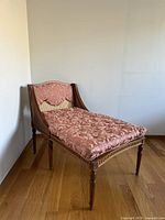 Three-quarter front view of chaise lounge showing overall form and upholstery