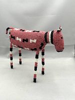 Front and side view of handcrafted beaded African antelope sculpture "Red Bokkie" showing full body and detailed beadwork