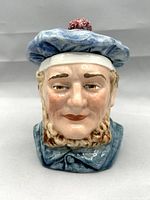 Front view of the polychrome majolica sailor head tobacco humidor showing detailed facial features and blue cap with red pompom.