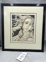 Full view of framed etching with visible mat and black frame, showing the artwork titled 'Venus' with flowing hair.