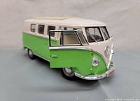 Front view of the 1962 Volkswagen Kombi 1/18 scale diecast model with open driver side door showing interior detail.