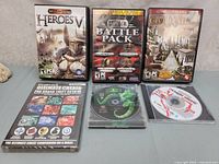 Collection of six games arranged in two rows showing cases and discs.