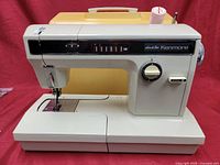 Full front view of Kenmore sewing machine model 158.19142 showing body, needle area, and top cover.