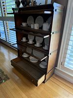 Side angle with open glass front sections showing interior shelves