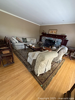 Full view of rug under living room furniture showing overall pattern and size.