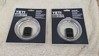 Pair of new Yeti Rambler MagSlider lids sealed on retail backing cards showing full lot contents.