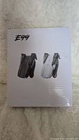 Front of the E99 drone packaging showing drone images in black and white