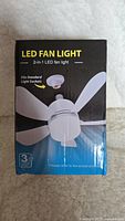 Box front showing LED Fan Light 2-in-1 design with image of product and 3 year warranty.