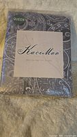 Front view of packaged KaceMoo queen sheet set showing grey paisley pattern and Queen size badge